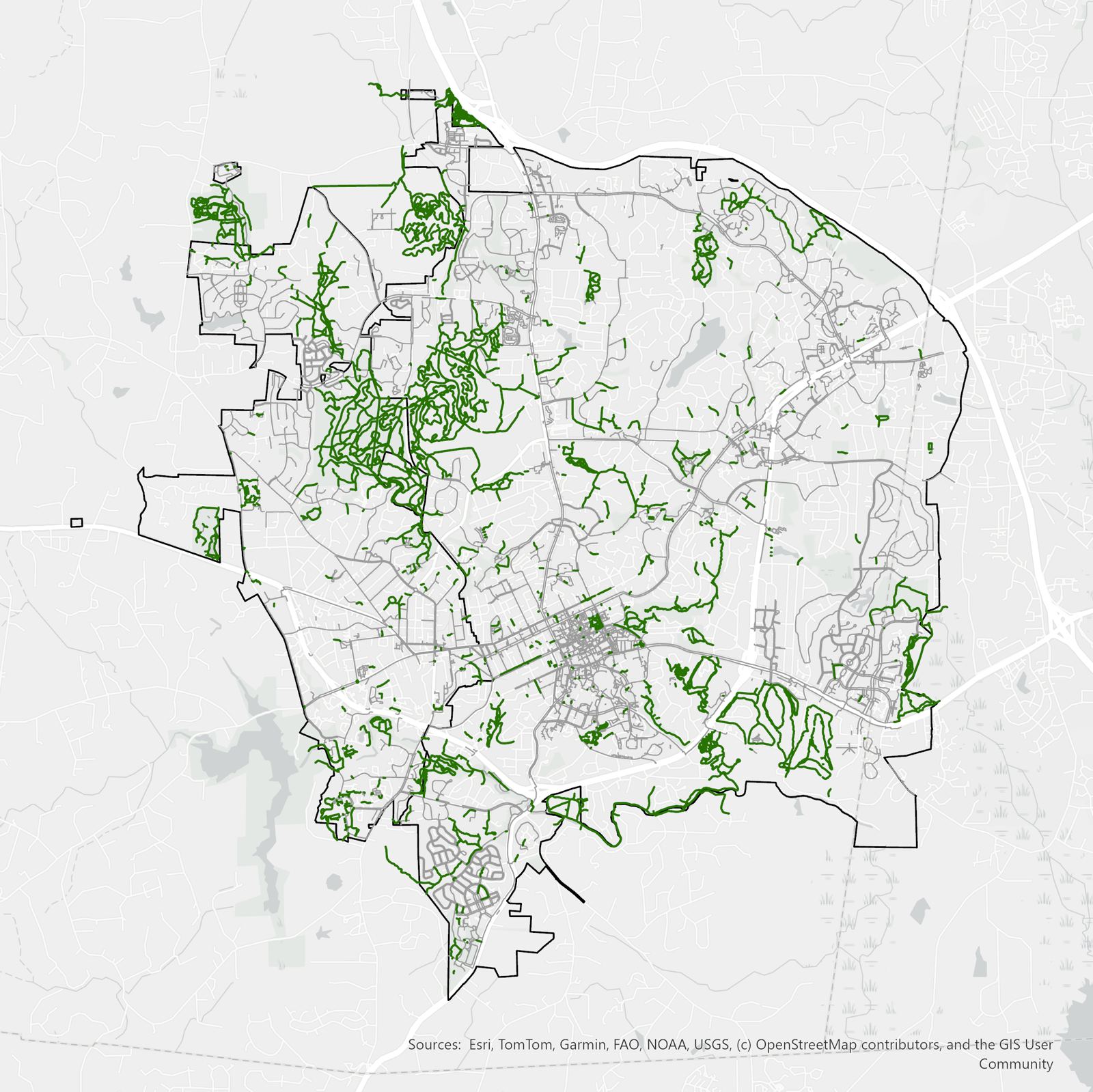 Map of Chapel Hill and Carrboro showing the paved street network in gray and natural surface trails in green, illustrating how extensive the unmapped trail network is.